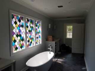 Stunning bathroom remodel featuring modern fixtures, stylish tilework, and a spacious layout, showcasing J&B Construction's exceptional craftsmanship in North Texas.